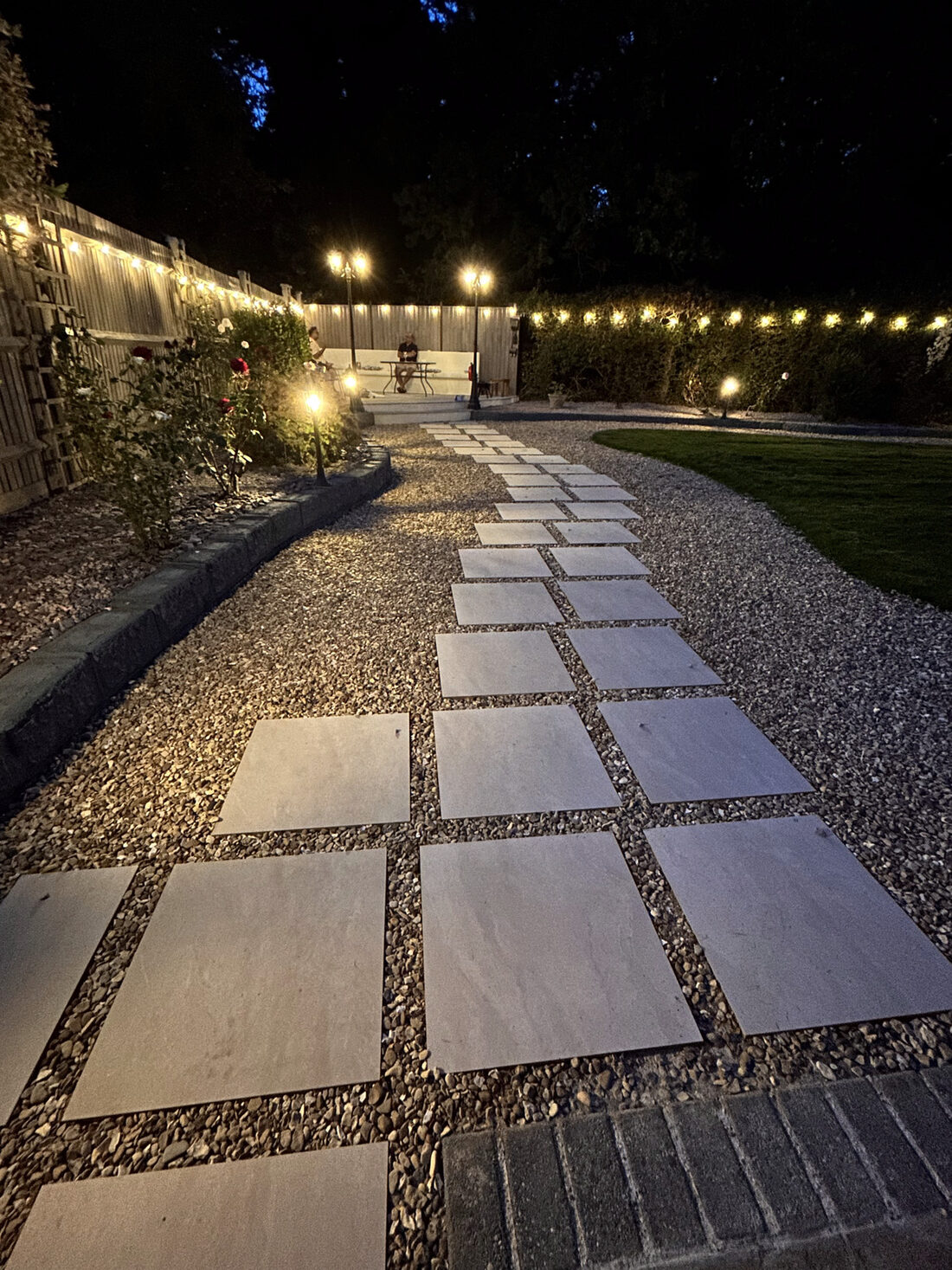 Landscaped garden with festoon lighting